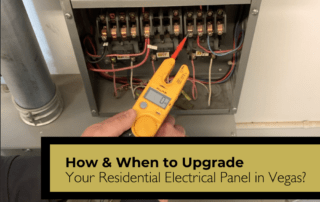 Open residential electrical panel with exposed wires and a hand holding a digital tester; caption about upgrading in Vegas.