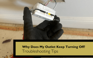 Gloved hand holds a white electrical outlet box with exposed wiring.