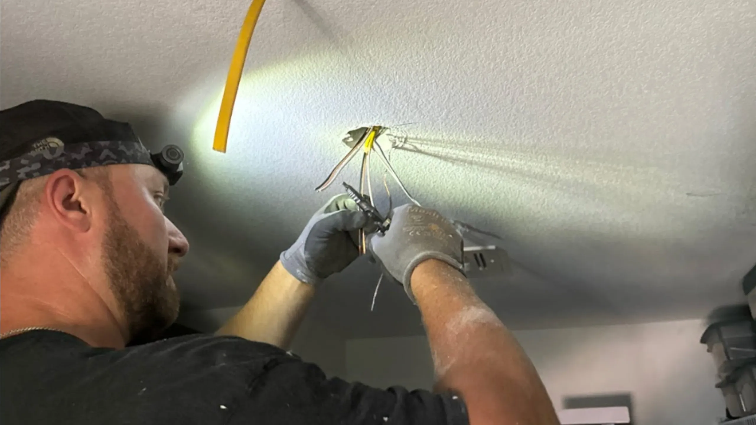 Electrical Troubleshooting An electrician from Electricode troubleshooting an electrical issue